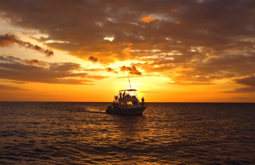 boat on water at sunset